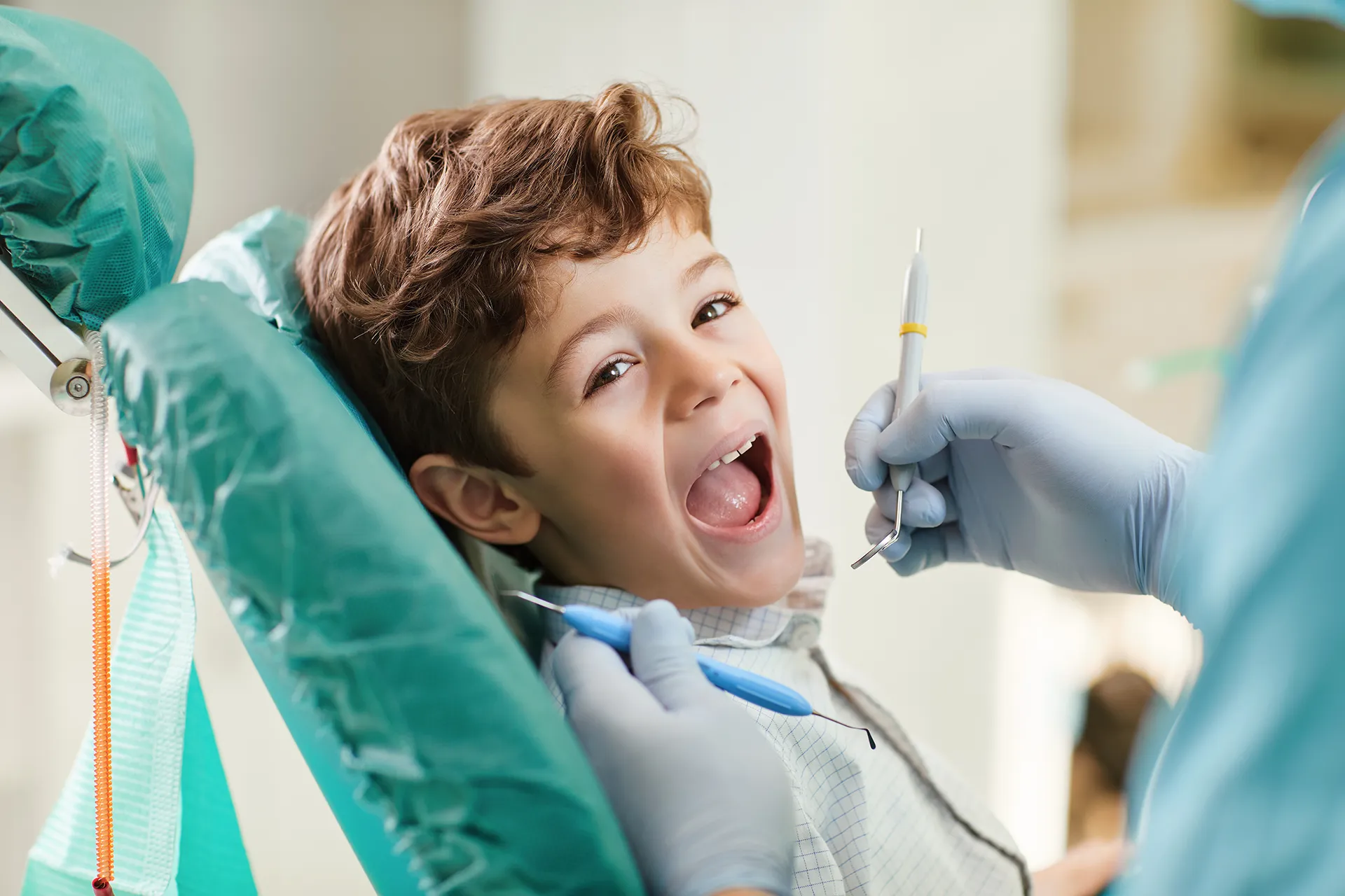 Little boy getting dental examination.
