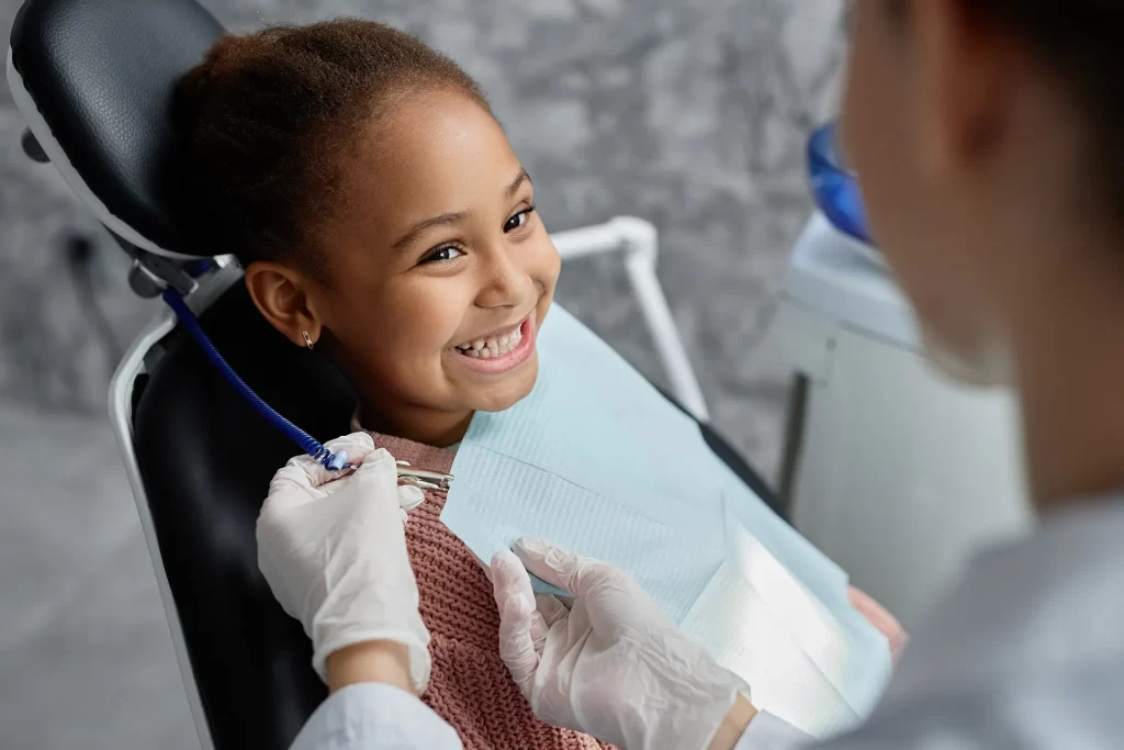Little girl getting dental examination.