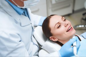 Woman smiling in an exam chair.