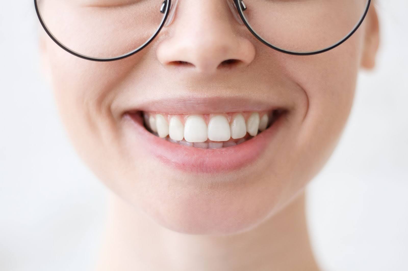 Closeup on a young woman’s smile.